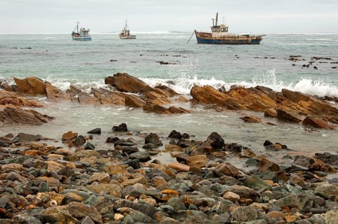 Fishing boats in bad weather at sea off the coast of Port Nolloth