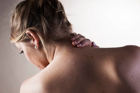 Young woman with neck pain
