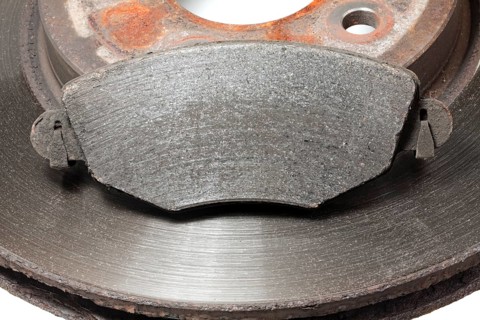 Worn brake disc with grooves from the brake pad