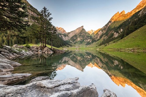 Mountains reflected at sunrise in Lake Seealpsee