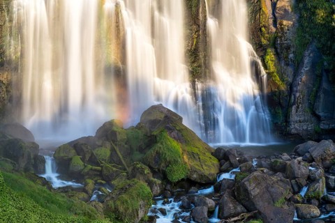 Marokopa Falls in the evening light with a rainbow