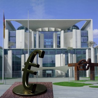 Sculpture of a euro sign in front of the German Federal Chancellery building