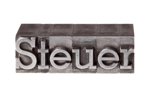 Old lead letters forming the word 'Steuer'