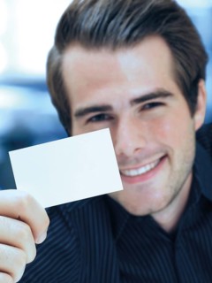Businessman showing blank business card