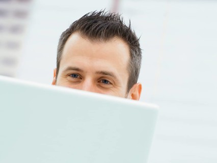 Businessman in an office with a laptop
