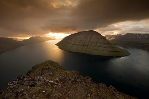 Dramatic mood lighting over the islands of Kalsoy