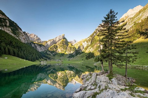 Mountains reflected at sunrise in Lake Seealpsee