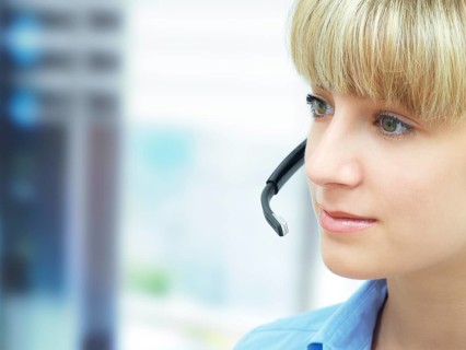 Businesswoman wearing a headset in an office