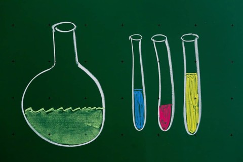 Laboratory flask and test tubes drawn with chalk on a blackboard
