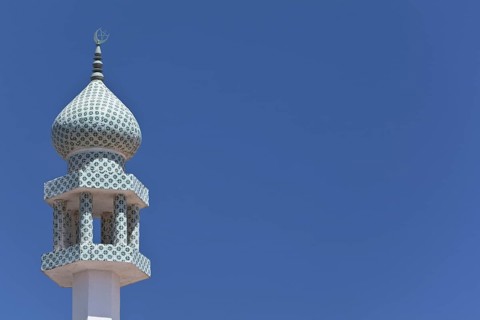 Crescent moon and a star at the top of a minaret