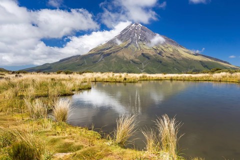 Mountain lake with the Mount Taranaki volcano