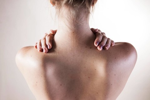 Bare shoulders of a young woman