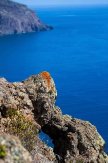 Cliff coast near Ponta do Pargo with lichen growing on the rocks