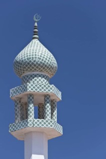 Crescent moon and a star at the top of a minaret