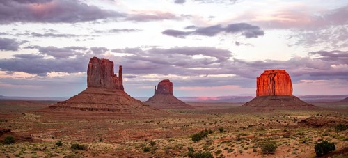 Red glowing rock formation at sunset