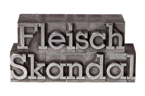 Old lead letters forming the term 'Fleischskandal'