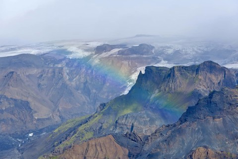 Gorges of Thorsmork below the Myrdalsjokull glacier with a rainbow