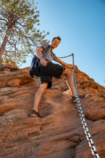 Young man hikes on Angels Landing Trail