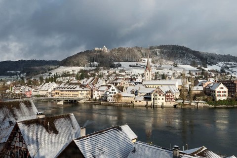 View over the Rhine River towards the historic town centre of Stein am Rhein with Burg Hohenklingen Castle