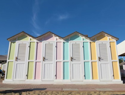 Pastel coloured beach cabins