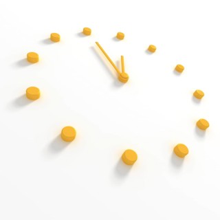 Yellow dial and hands of a clock