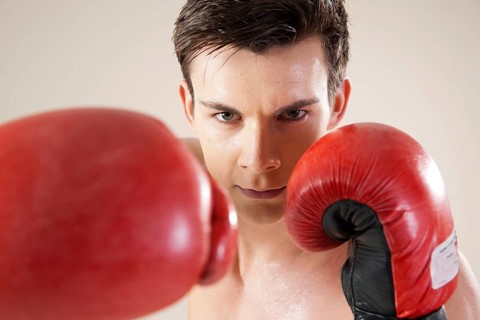 Young man during boxing training