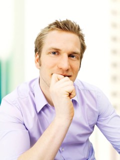 Businessman holding his hand on his chin