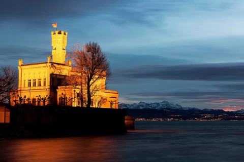 Schloss Montfort Castle on Lake Constance at dusk