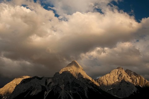 Last sunlight shining on the peaks of the Mieming Range with the mountains Ehrwalder Sonnenspitze and Gruenstein