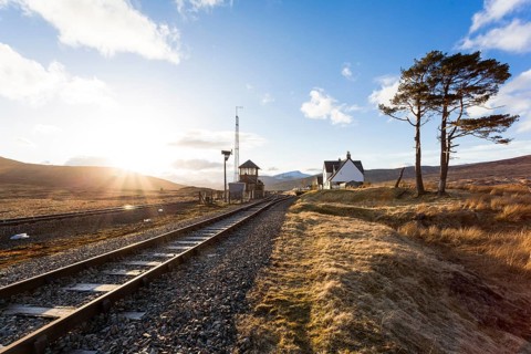 Railway tracks and a railway station in the Scottish Highlands