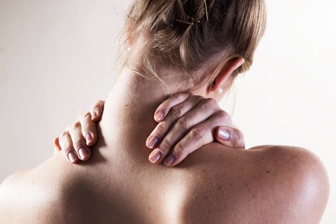 Young woman with neck pain
