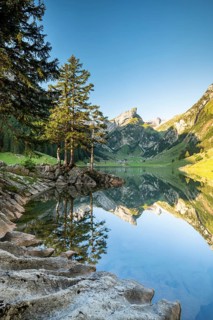 Mountains reflected at sunrise in Lake Seealpsee