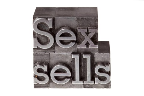 Old lead letters forming the phrase 'Sex sells'