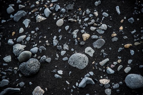 Basalt stones in black lava sand