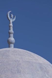 Top of a mosque with a crescent moon and a star