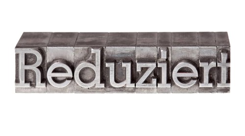 Old lead letters forming the word 'Reduziert'