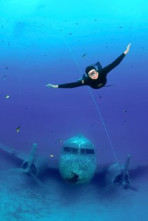 Freediver at plane wreck Douglas Dakota