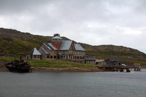 Derelict houses of a rural locality on the Barents Sea
