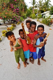 Children with ukulele toys
