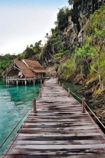Wooden pier and water bungalows in a holiday resort
