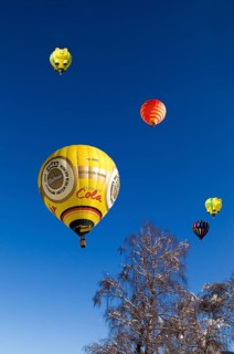 Hot air balloons against a blue sky