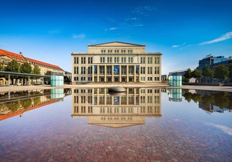 Opera Leipzig with reflection in the water of the Opernbrunnen
