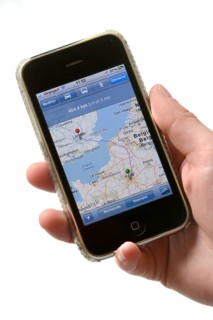 Hand holding an Apple iPhone