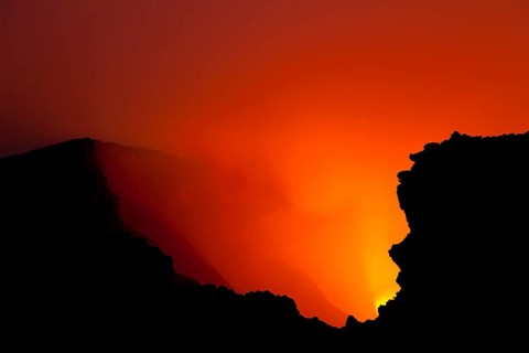 Glow of the lava lake boiling in the crater of Mount Nyiragongo volcano