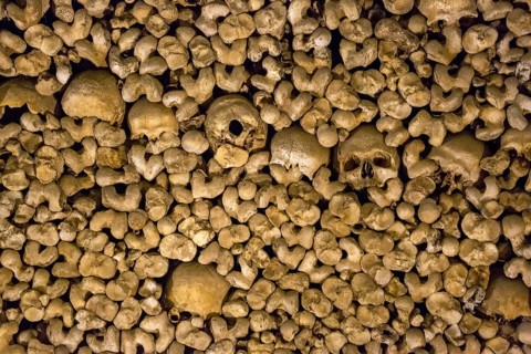 Stacked bones and skulls in the ossuary