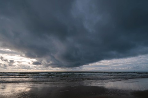 Dramatic cloud formation over a North Sea beach