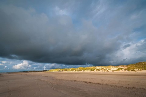 Dramatic cloud formation over a North Sea beach