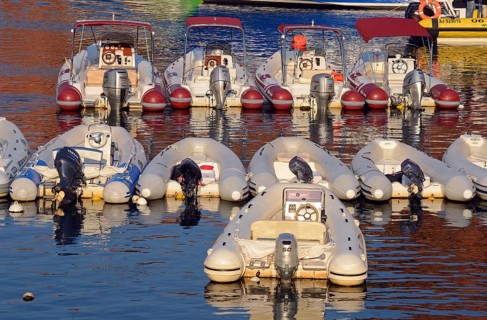 Inflatable boats with outboard motors in the harbor of Porto