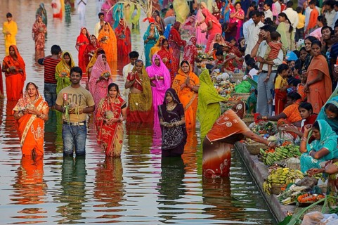 Hindus standing in water during the Hindu Chhath Festival