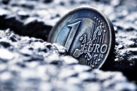 A one euro coin sticking in crevice